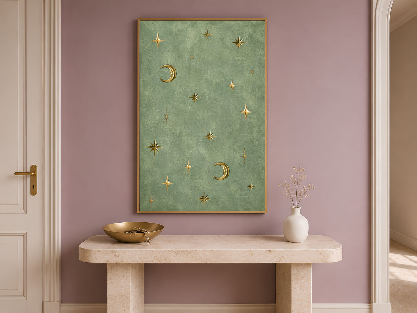 Vintage celestial moon and stars wall art hung above an entryway console table, gold and sage green astrology print