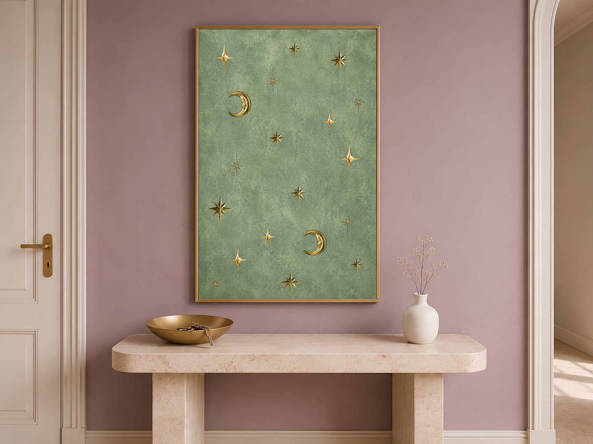 Vintage celestial moon and stars wall art hung above an entryway console table, gold and sage green astrology print