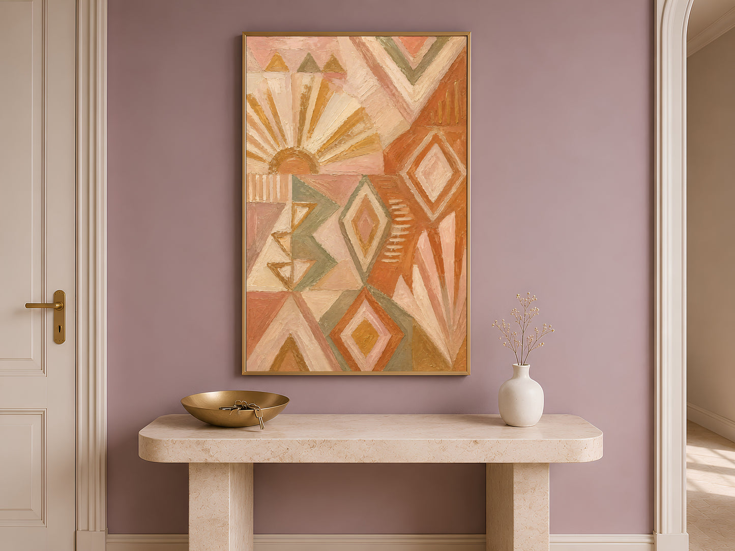 Boho geometric wall art framed above a wooden entryway console table with a small bowl and vase
