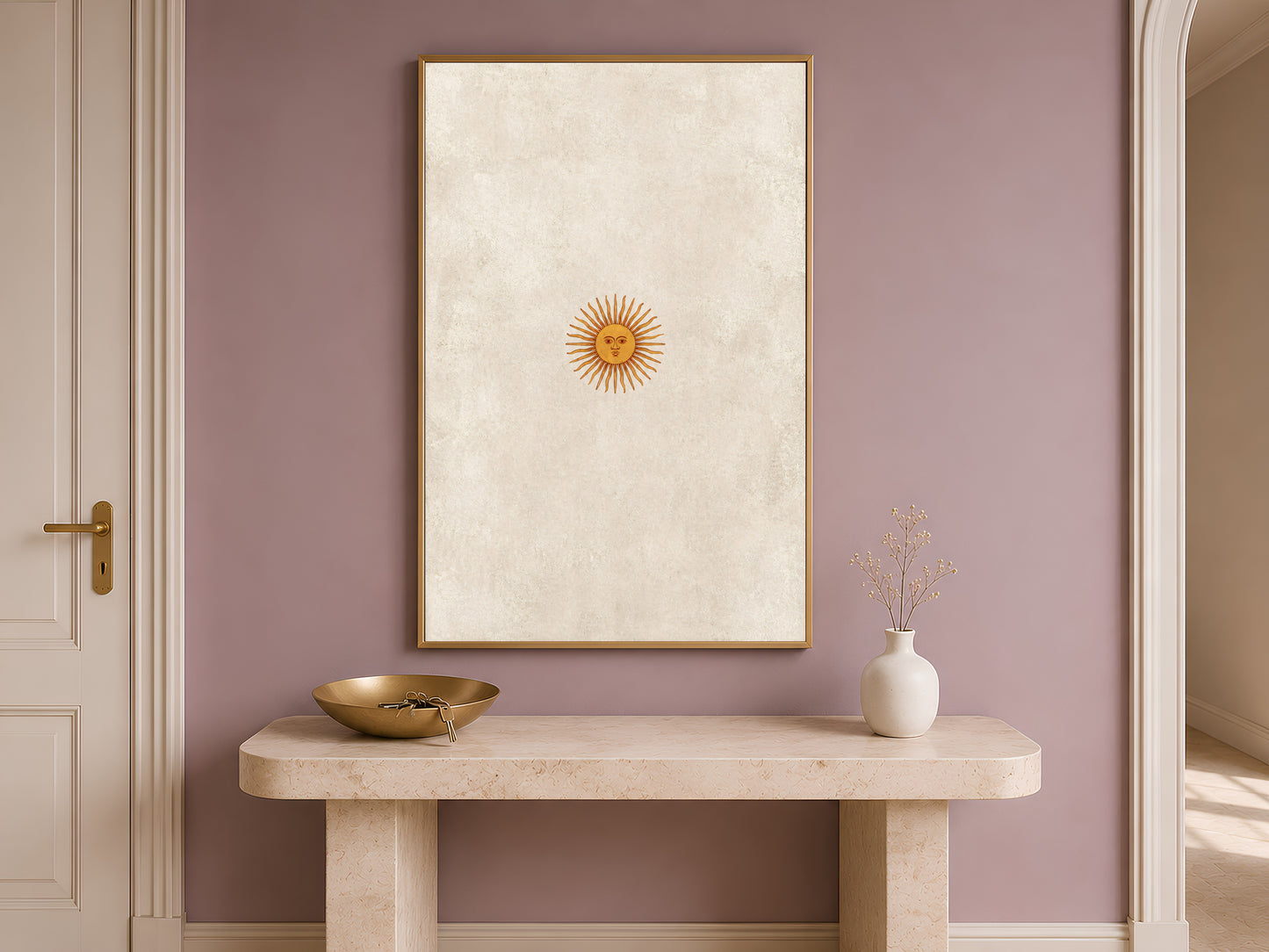 Vintage sun face wall art hung above an entryway console table, minimalist celestial print in gold and neutral