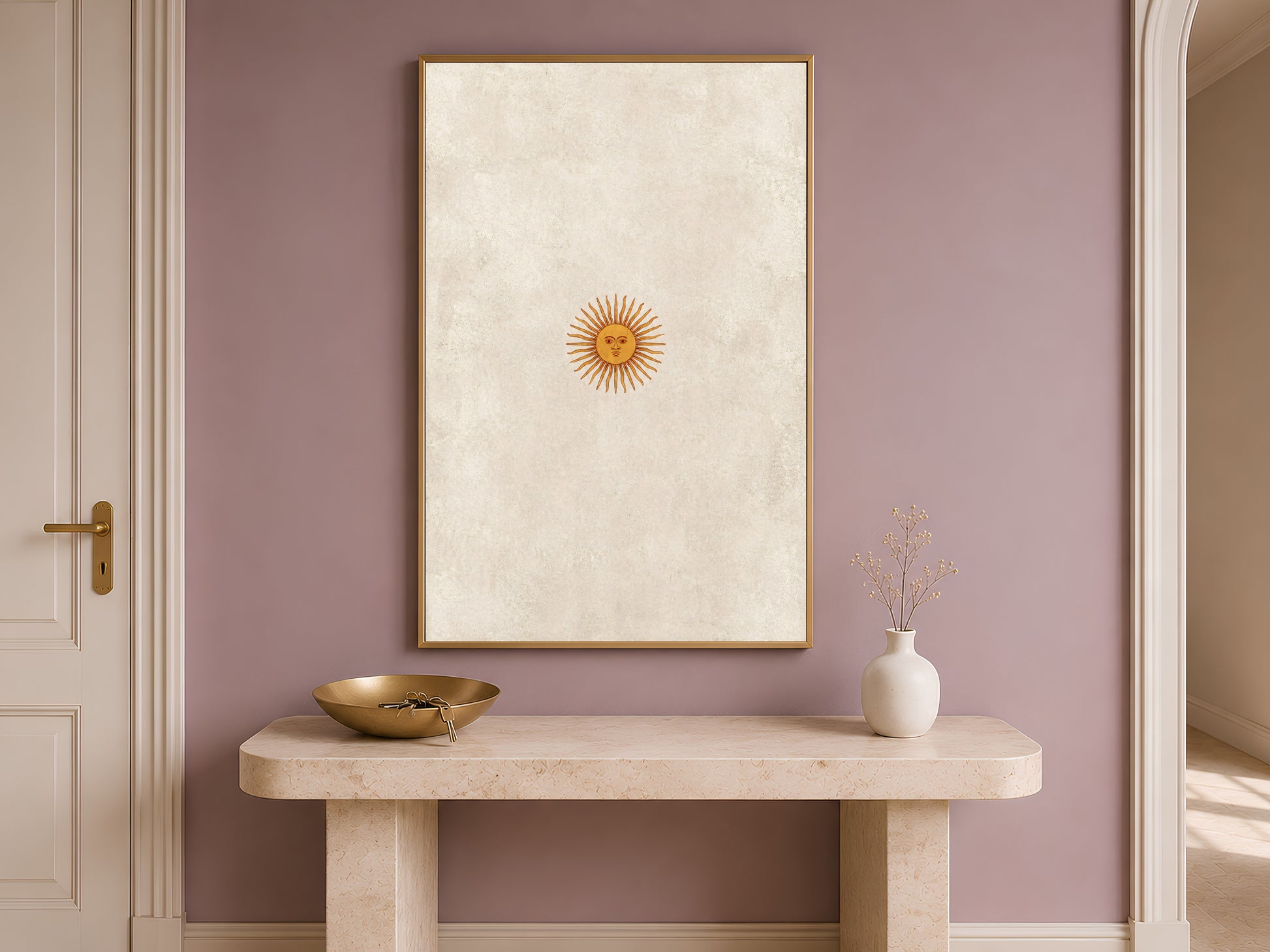 Vintage sun face wall art hung above an entryway console table, minimalist celestial print in gold and neutral
