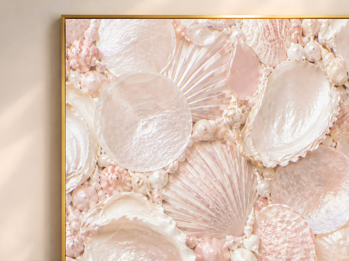 Close-up of blush pink and ivory seashell mosaic texture with fan shells and pearl discs