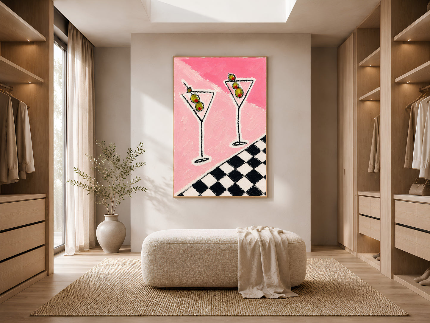Large framed impasto martini print leaning against white wardrobe wall in bright minimal dressing room with ottoman
