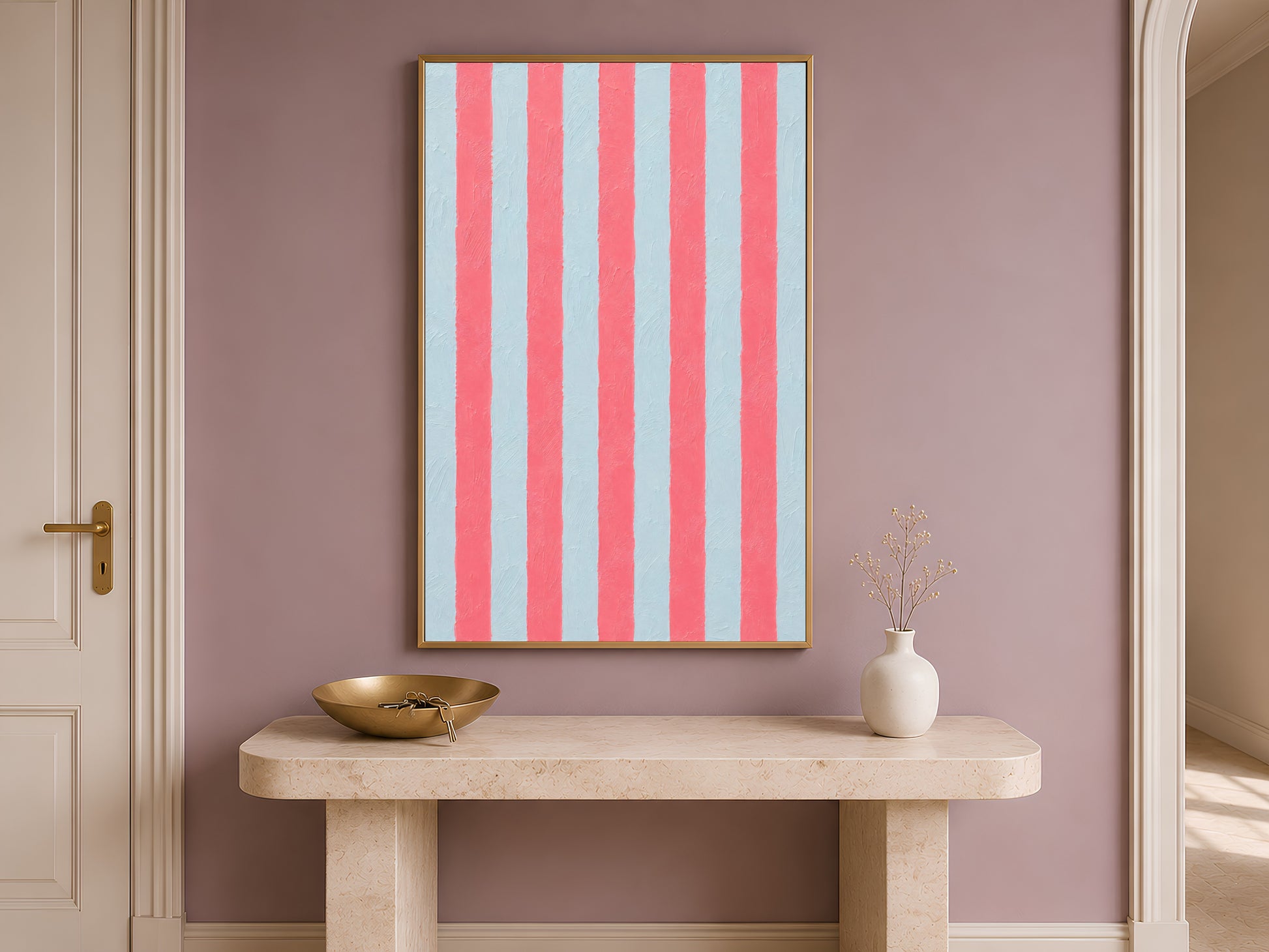 Framed abstract cabana stripe print on a console table in a mauve entryway