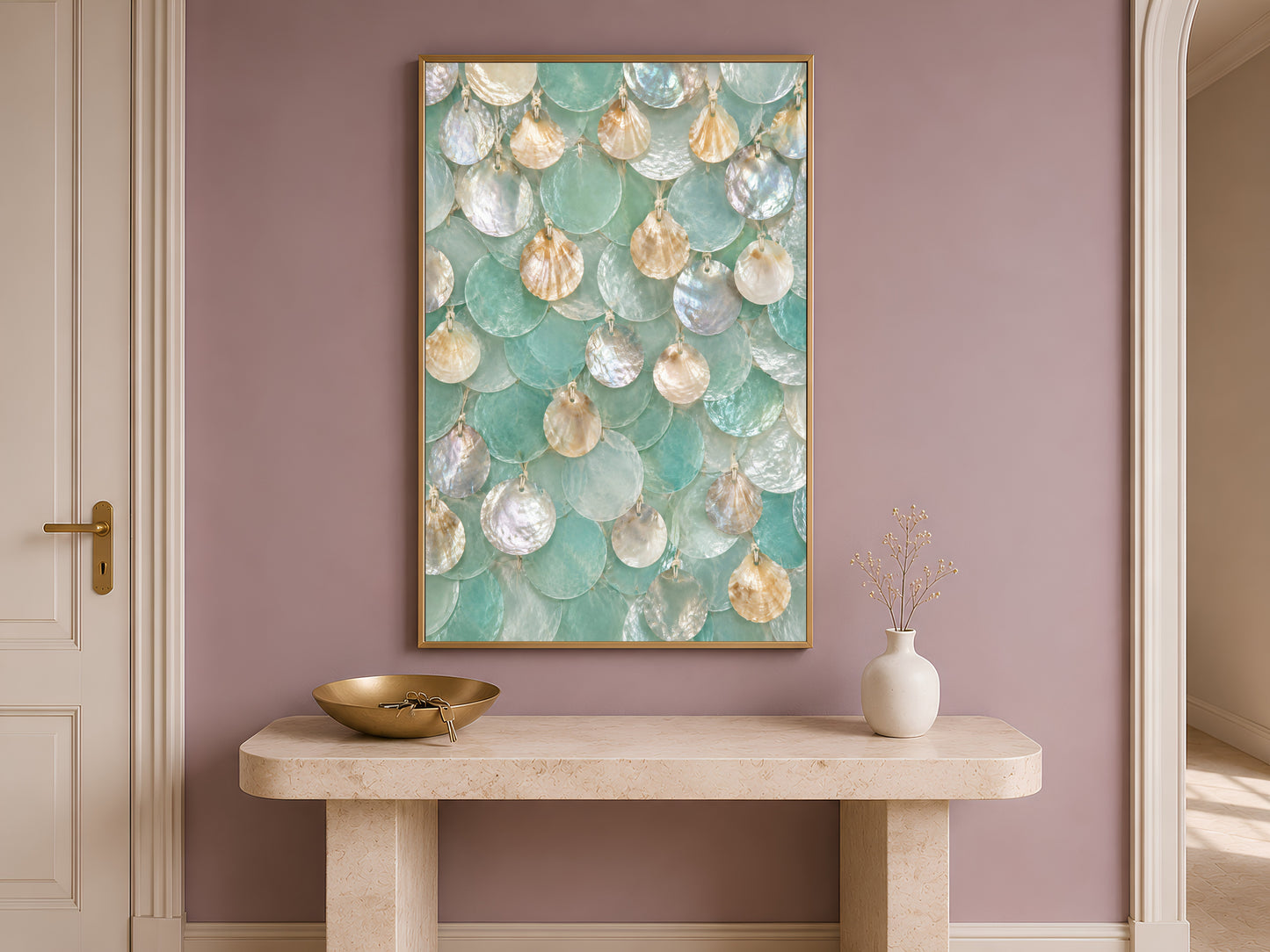 Seafoam capiz shell wall art framed above a console table in a warm entryway
