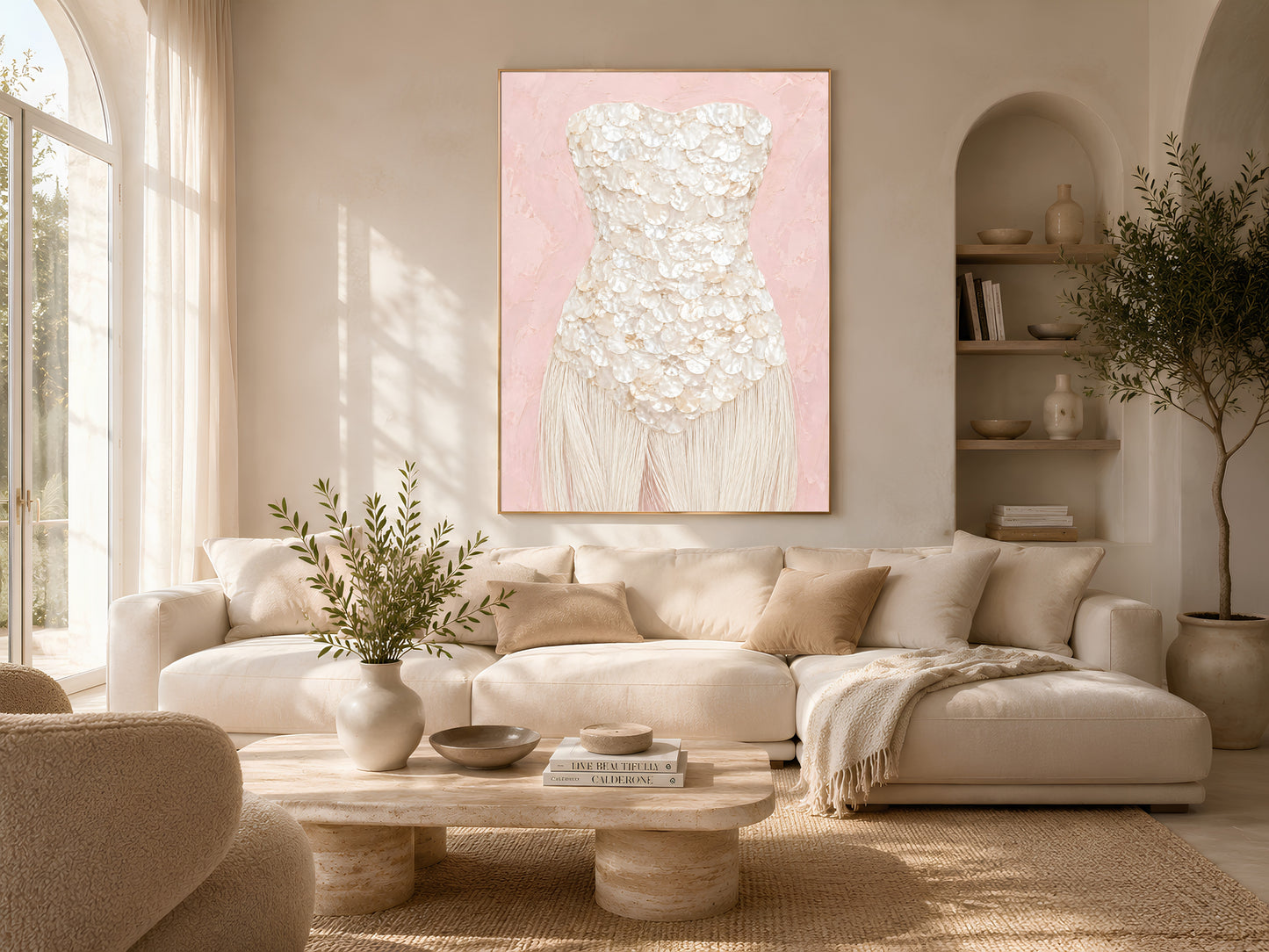 Blush pink mother of pearl wall art framed in gold, hung above a freestanding tub in a sunlit bathroom.