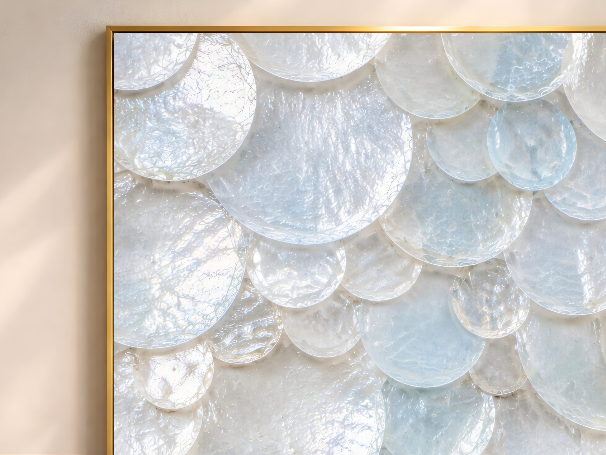 Close-up of the aqua and white sea glass shell mosaic print showing the translucent layered texture in a thin gold frame.
