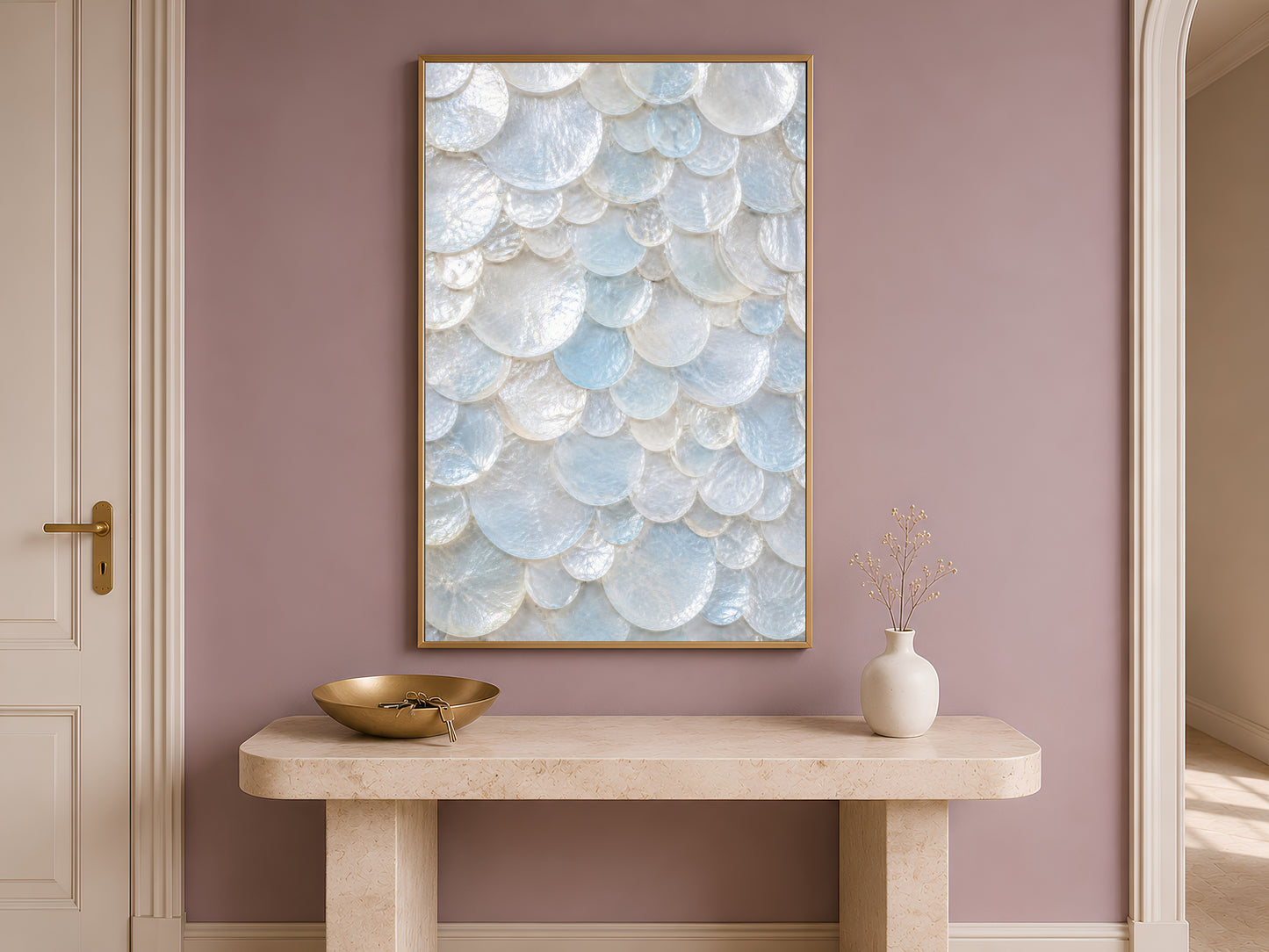 Sunlit arched hallway with a console table, fresh flowers, and a framed aqua sea glass print on the mauve wall.