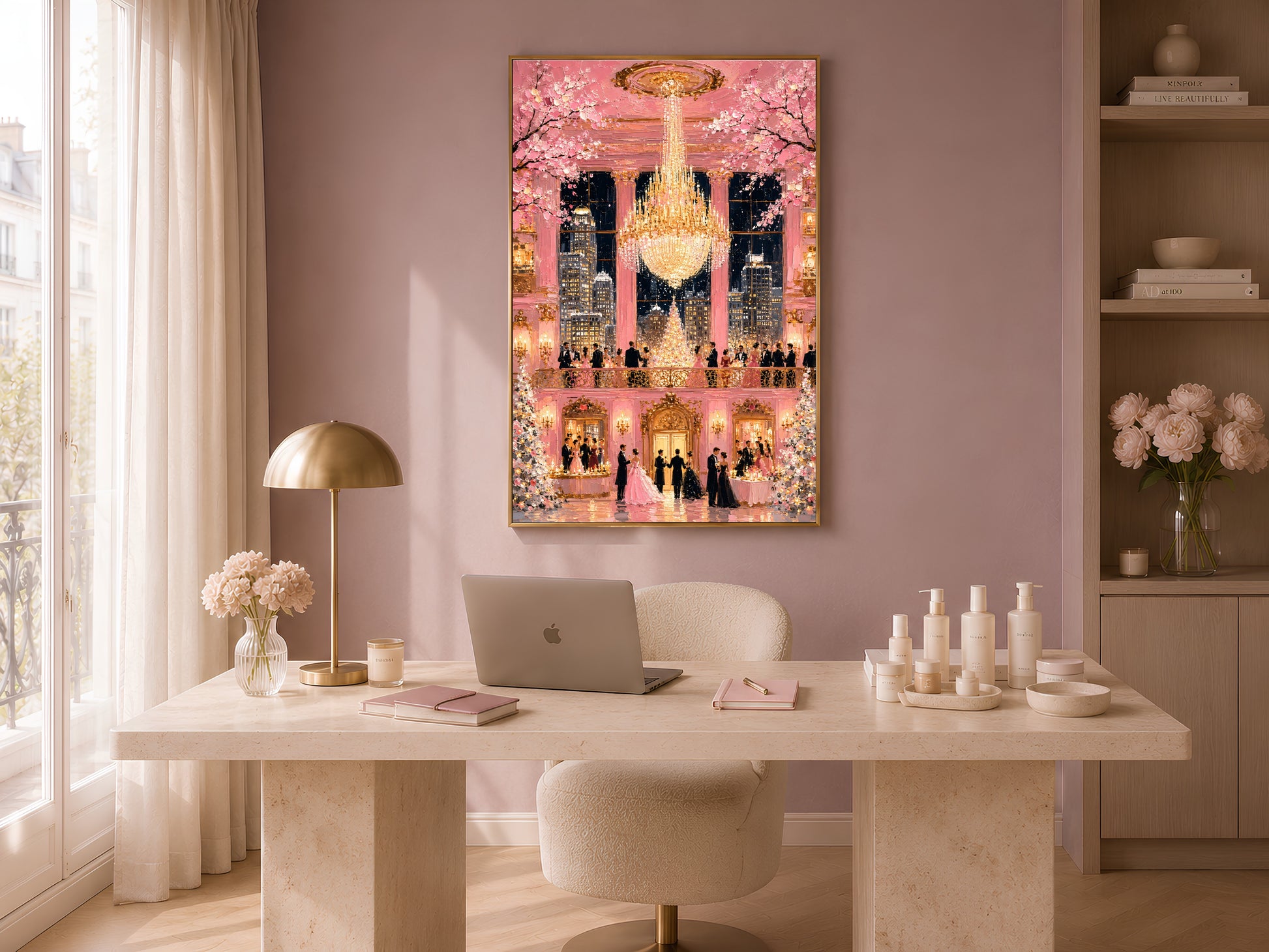 Pink fairytale ballroom chandelier print in gold frame in warm home office above white desk with lamp and candles
