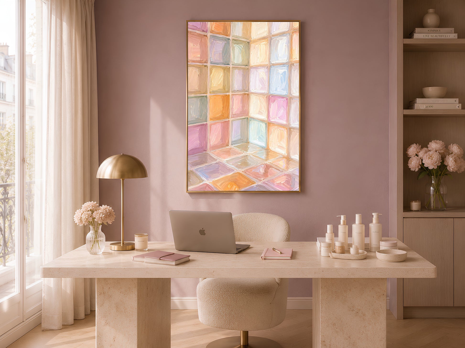 Rainbow pastel mosaic tile wall art in gold frame in bright home office above white desk with lamp and vases
