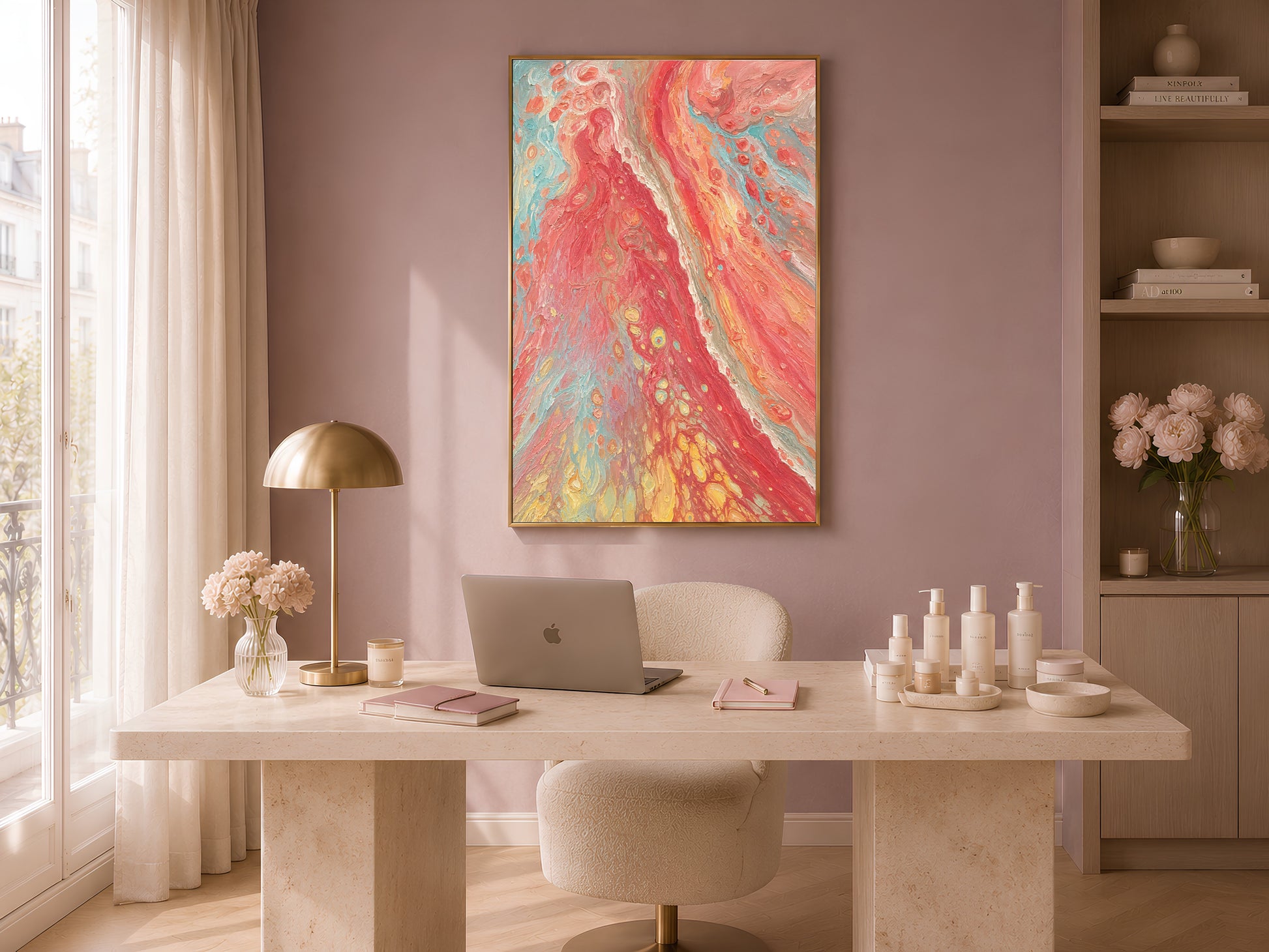 Coral red abstract swirl wall art in gold frame in warm home office above marble desk with candles and neutral vases

