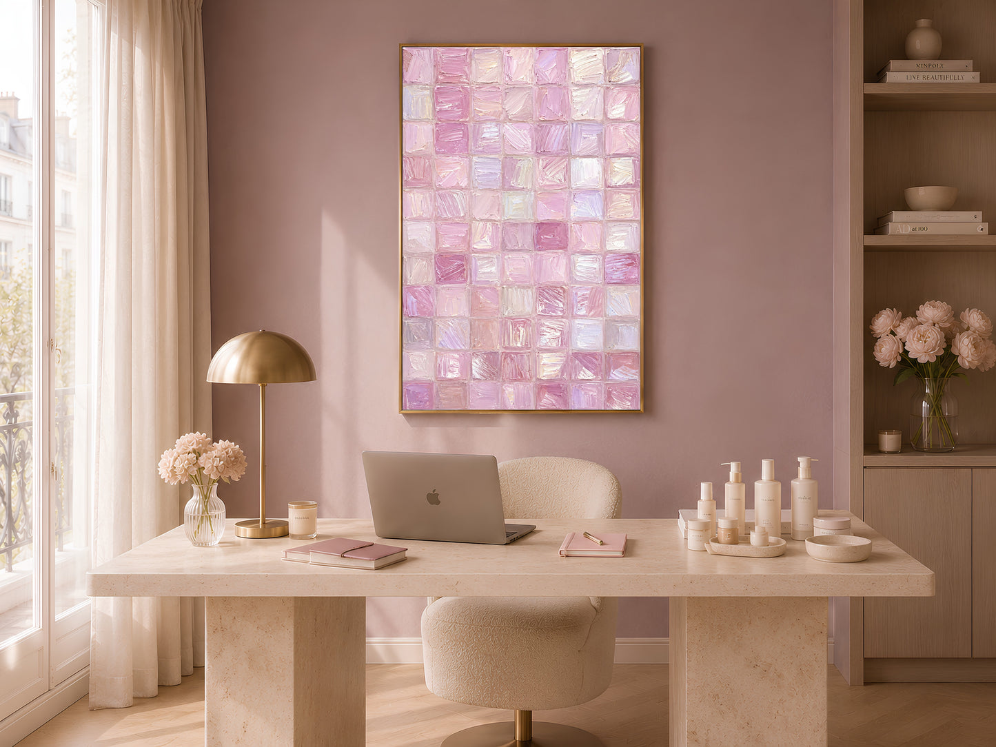 Pink impasto mosaic tile wall art in gold frame in warm home office above white desk with lamp and candles
