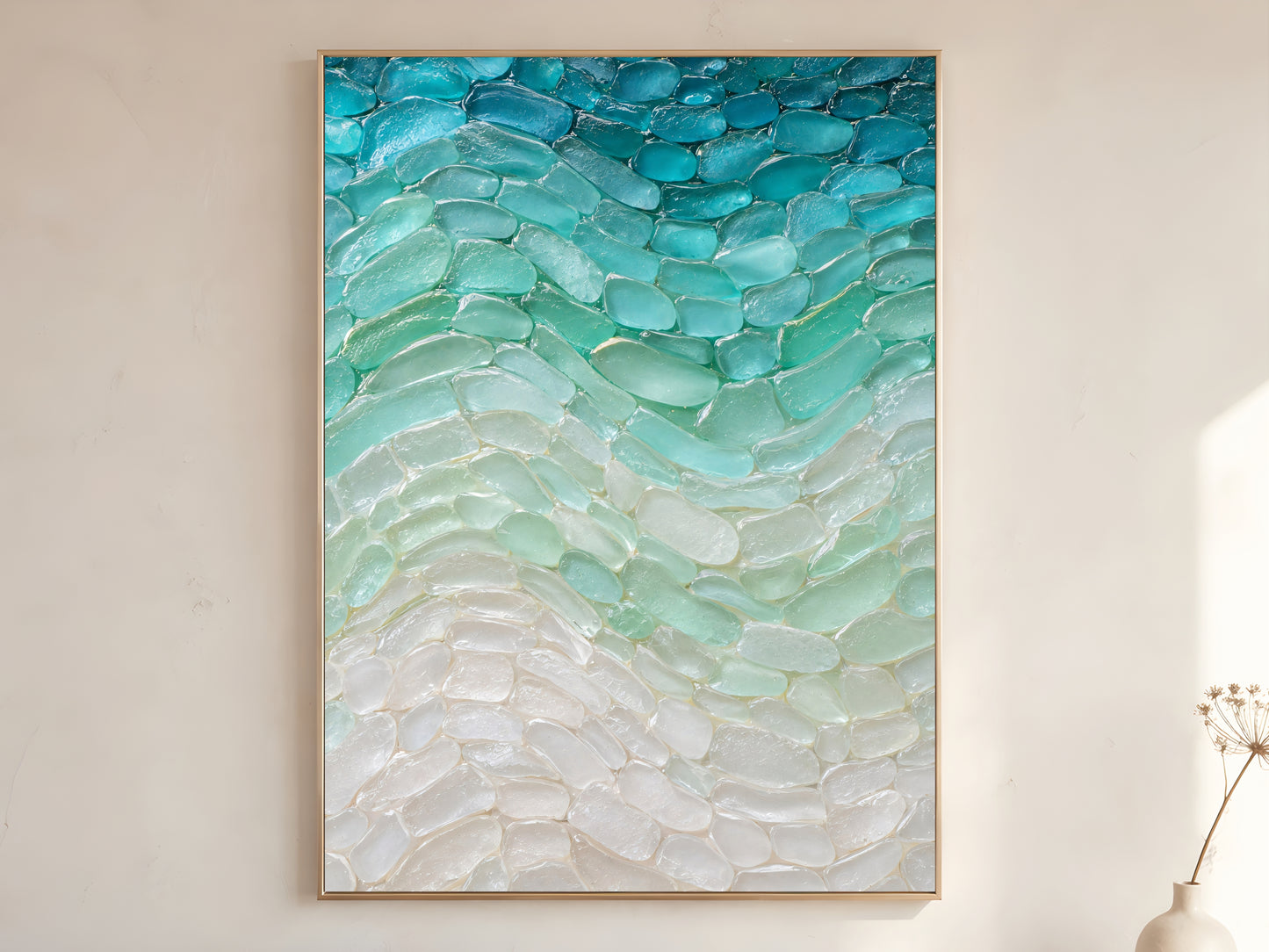 Sea glass wave wall art print in wood frame on warm white wall in minimalist coastal living room