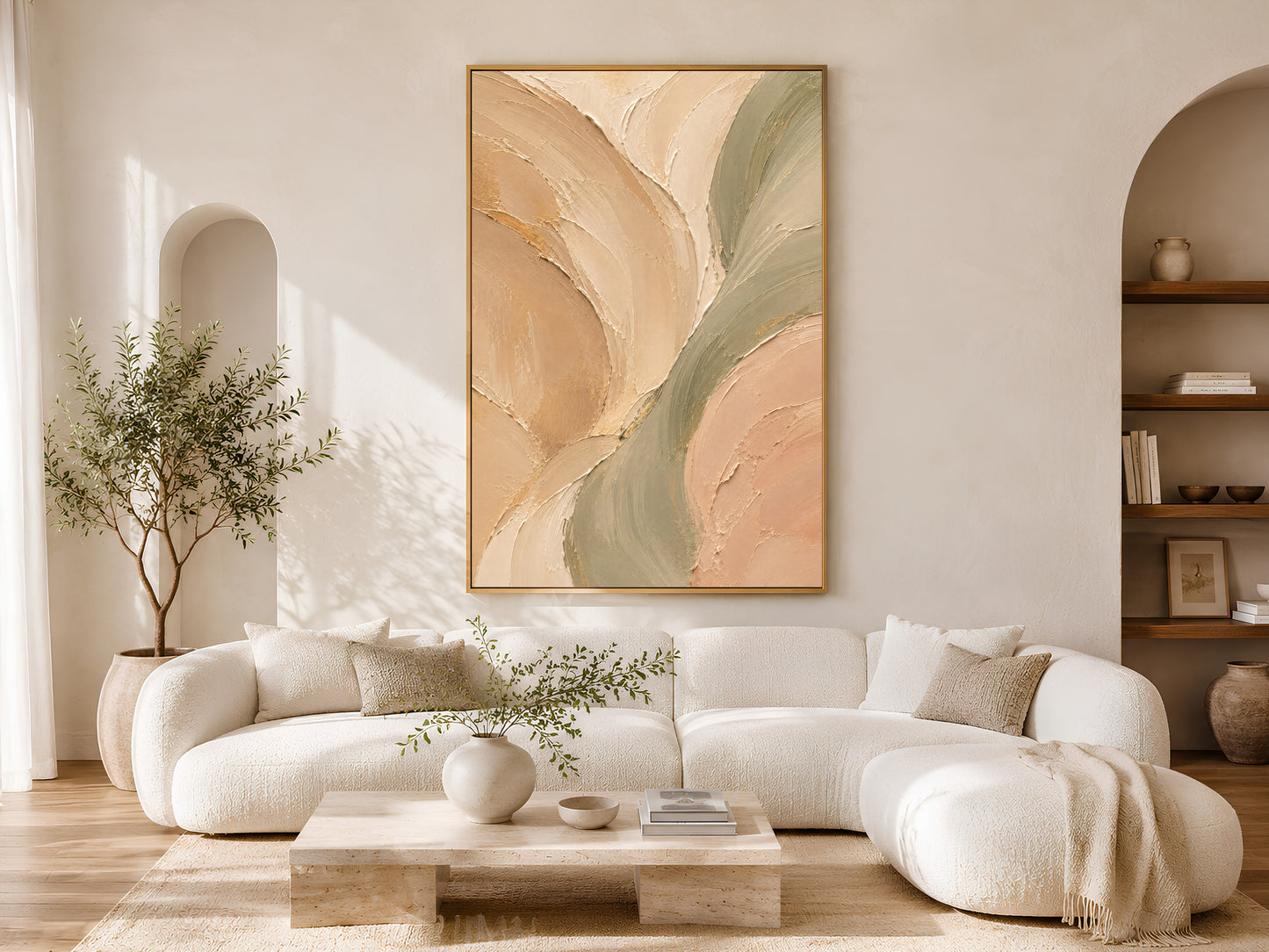 Sage green beige neutral abstract print in gold frame in minimalist living room with white sofa and olive tree
