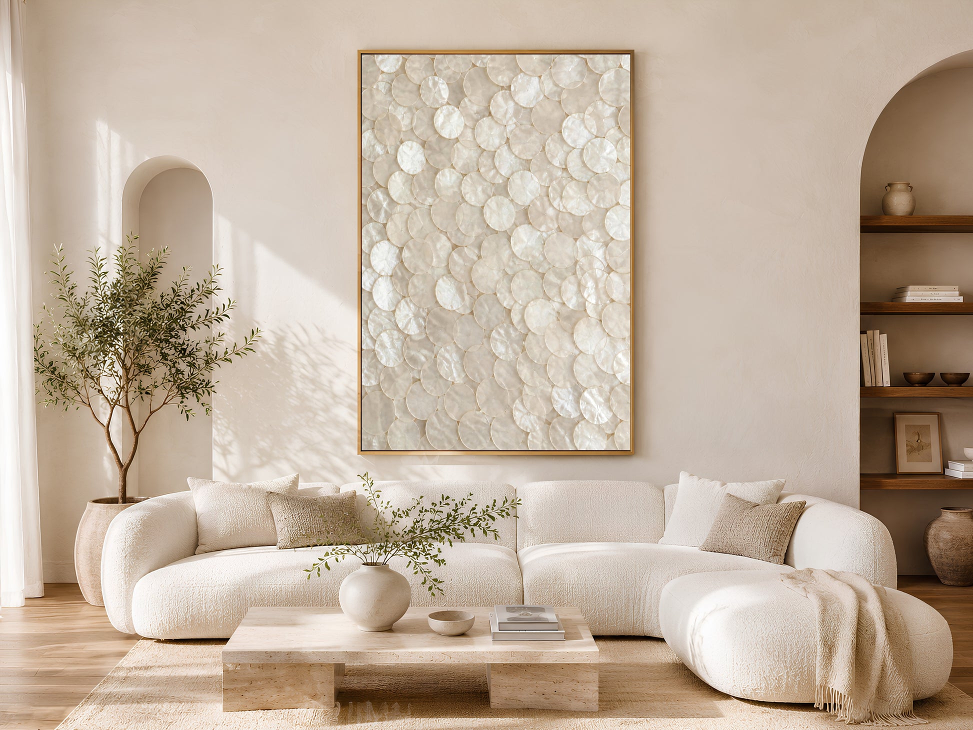 Capiz shell mosaic wall art framed in a living room with a curved white sofa
