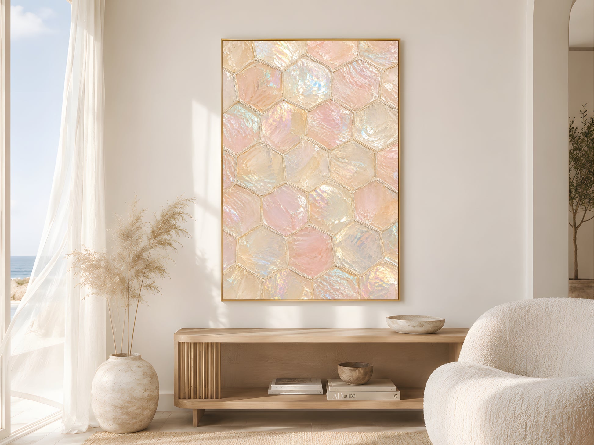 Iridescent capiz honeycomb print in gold frame in bright neutral living room with cream armchair and pampas grass