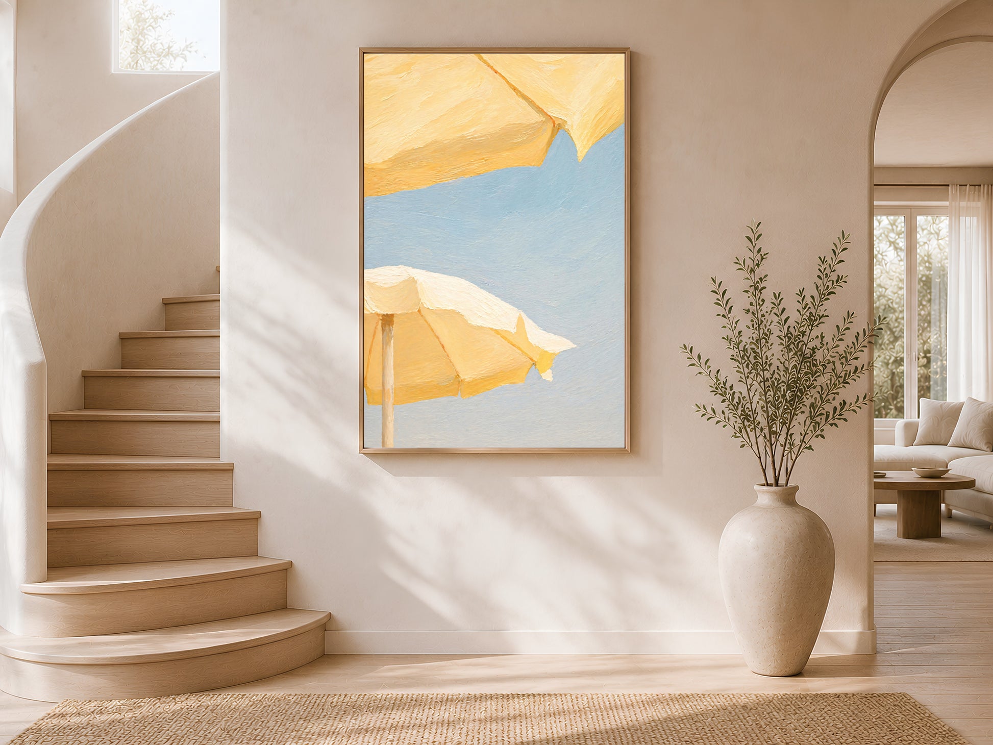 Butter yellow beach umbrella print framed above a curved staircase in a sunlit entryway
