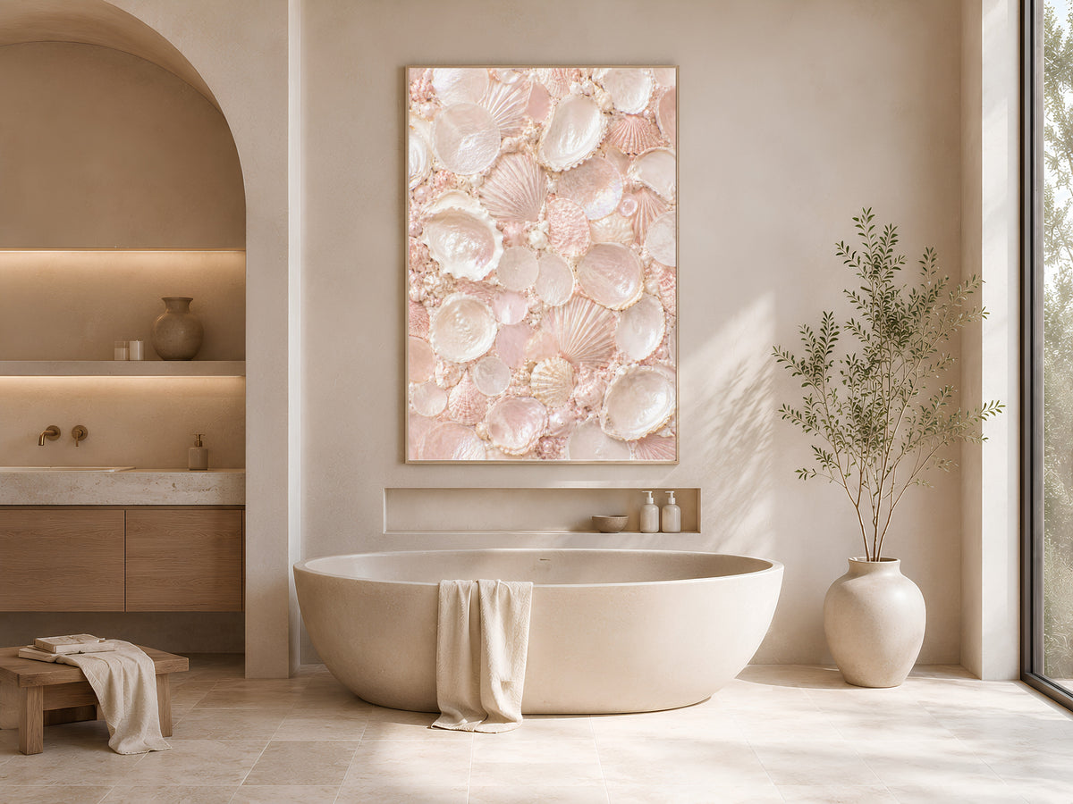 Framed blush pink shell mosaic wall art in a sunlit arched bathroom nook