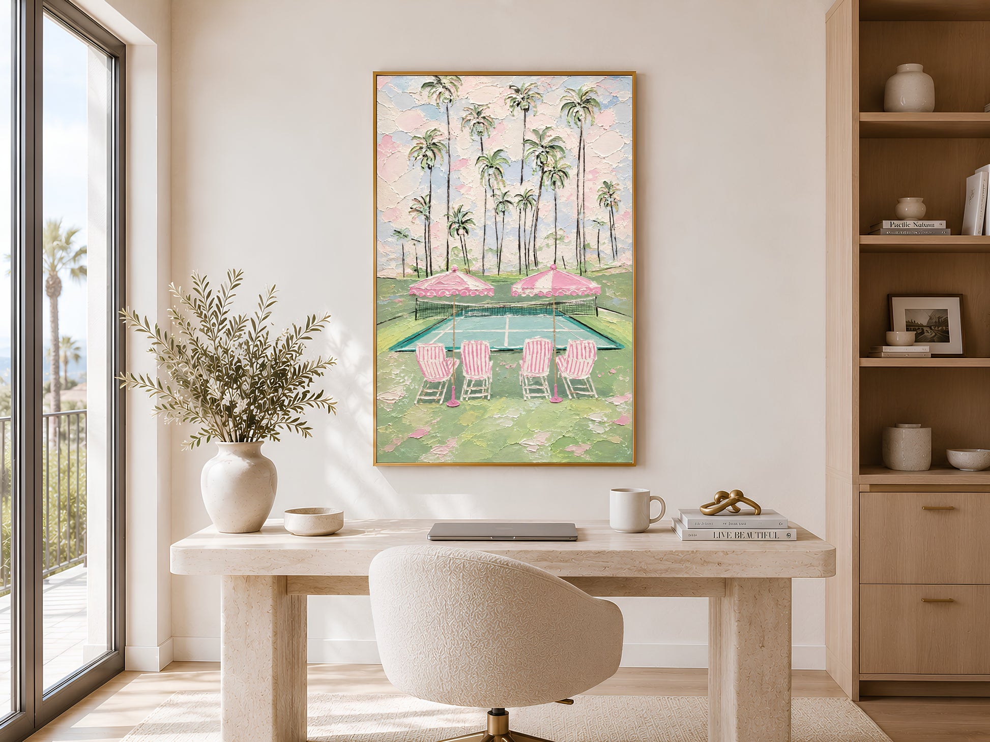 Pink tennis court wall art in gold frame in bright home office above white desk beside window
