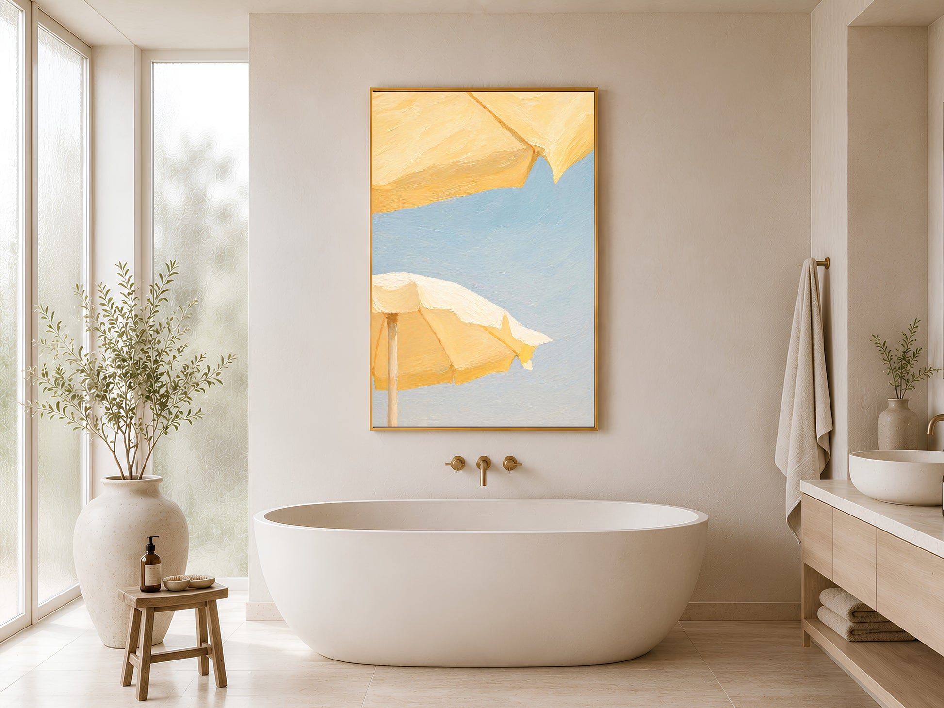 Butter yellow beach umbrella wall art framed above a freestanding bathtub
