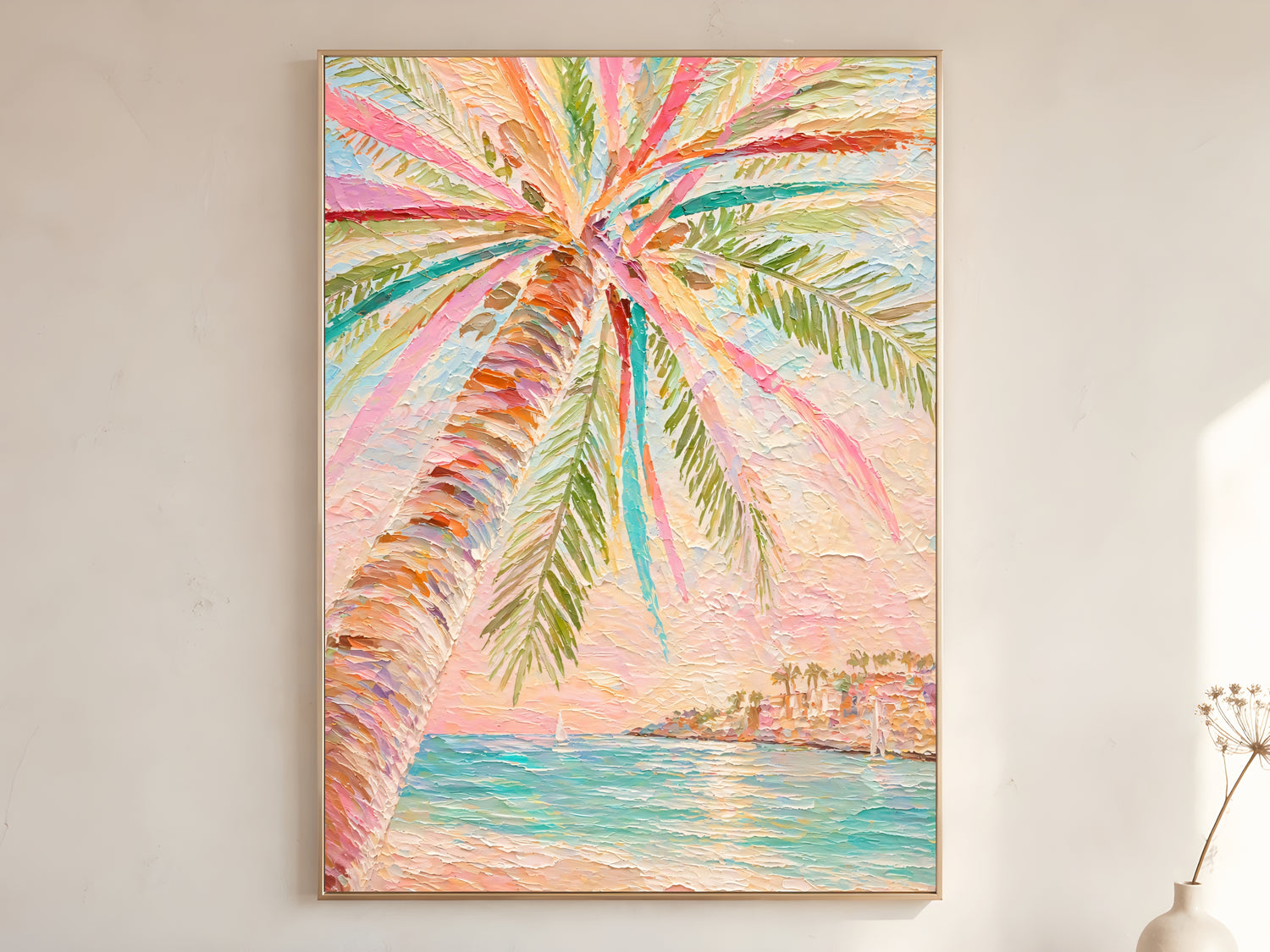 Pastel palm tree impasto wall art print in gold frame displayed on warm white living room wall with blush pink coral teal and sage green fronds

