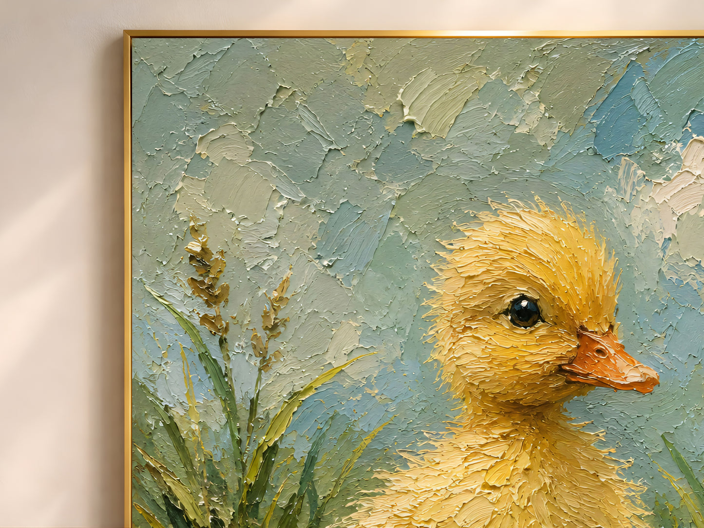 Close-up detail of duckling wall art showing thick impasto brushwork in soft yellow, sage green, and sky blue tones with fine feather texture
