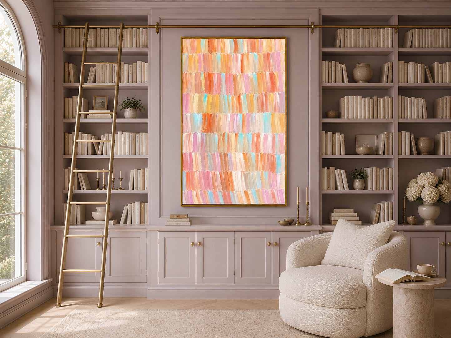 Framed colorful pastel impasto brushstroke art displayed in a warm library with tall built-in bookshelves and reading chair
