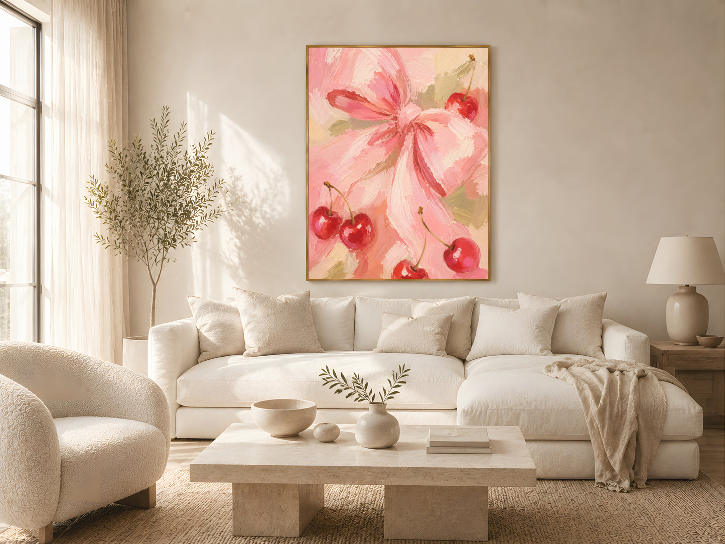 Cherry bow coquette wall art in gold frame above a low rattan coffee table in a warm boho living room