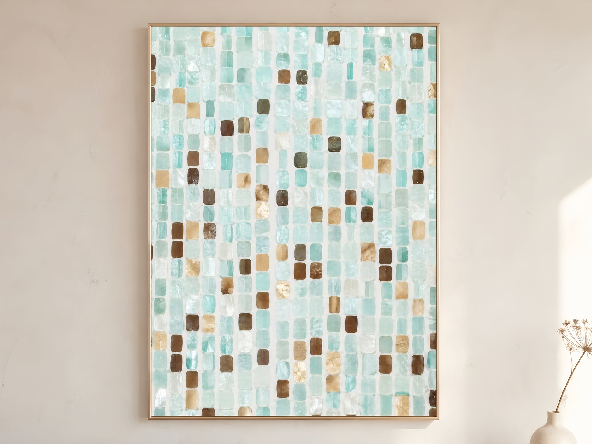 Teal mosaic tile wall art print in gold frame displayed on warm white living room wall showing soft aqua teal sand brown and pearl white iridescent tile pattern
