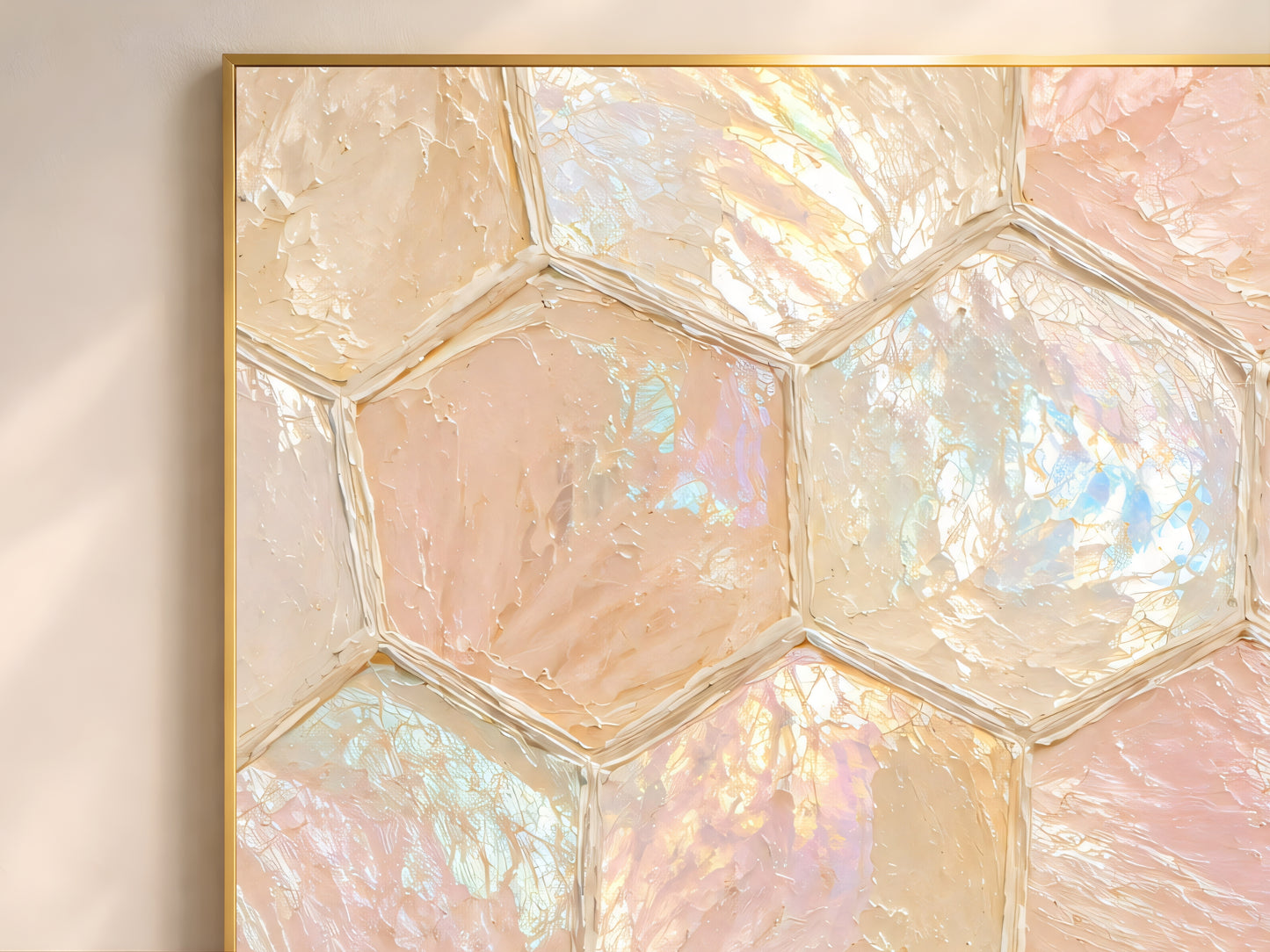 Close up of capiz shell honeycomb wall art showing iridescent blush pink champagne and ivory hexagonal tiles