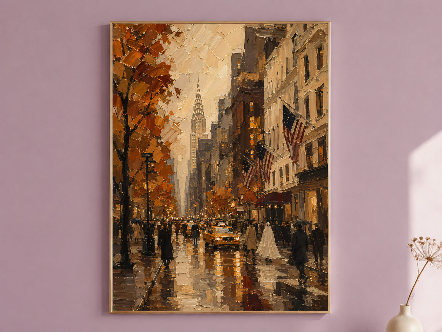 Rainy autumn New York City street art print in a thin gold frame on a dusty mauve wall, styled with a small vase of dried flowers
