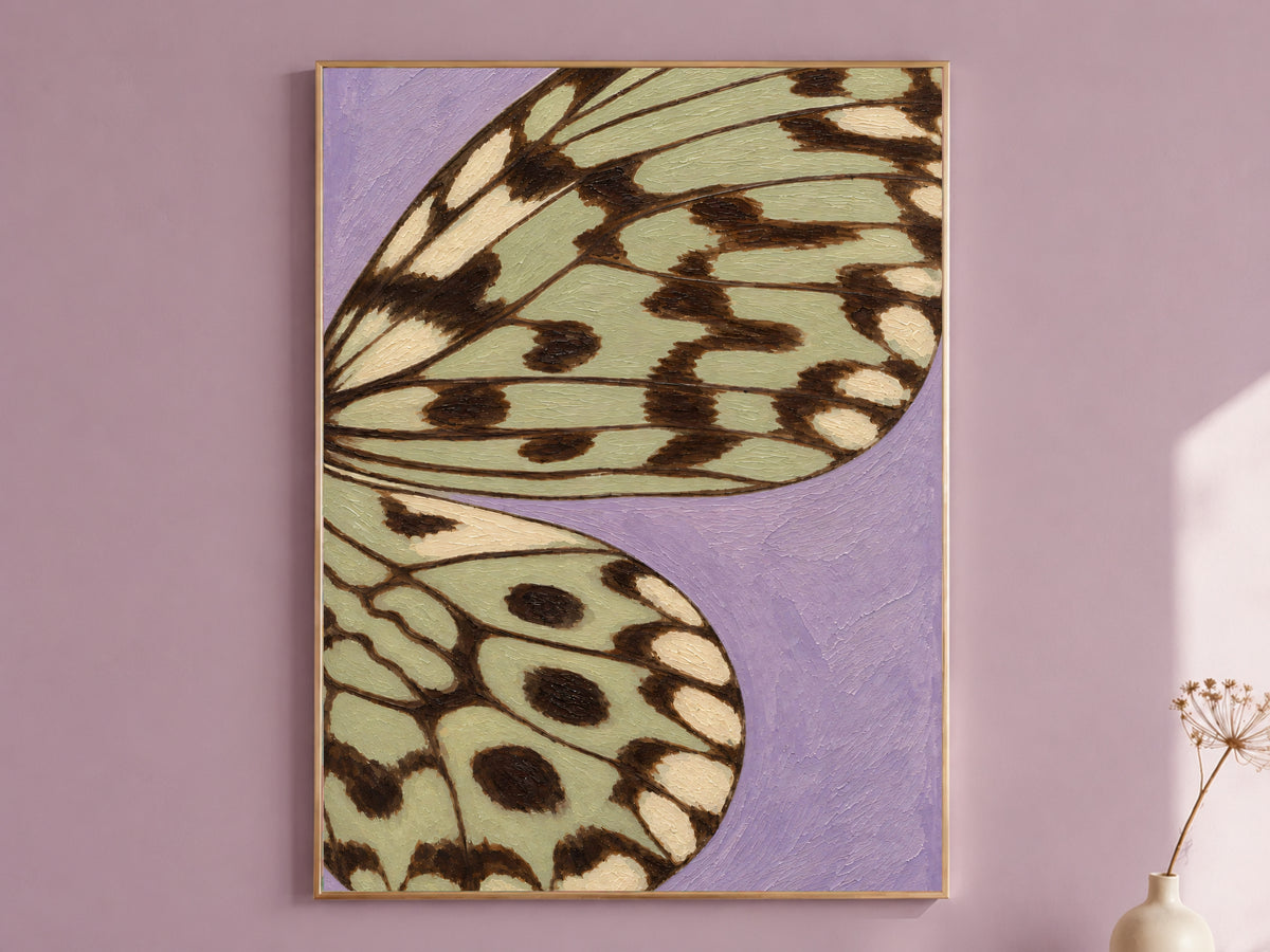 Framed lavender and sage green butterfly wing wall art print on a mauve accent wall
