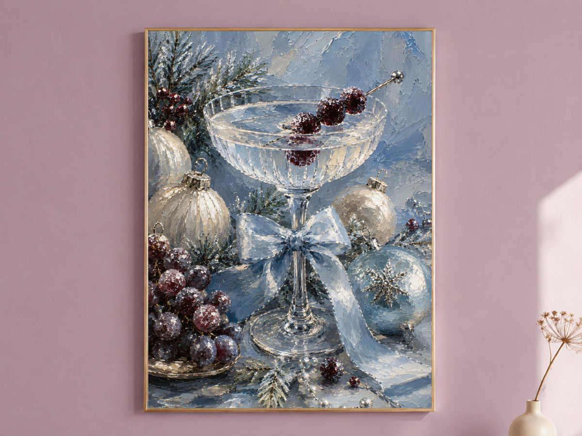 Christmas cocktail wall art print of a champagne coupe still life framed in gold, hung on a dusty mauve wall