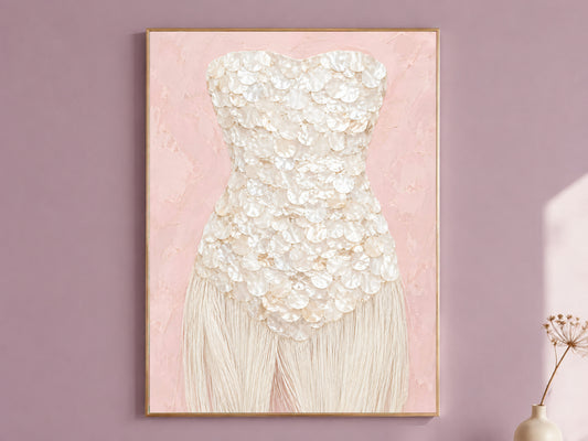 Blush pink wall art print with an ivory mother of pearl bodice, framed in gold against a mauve wall.