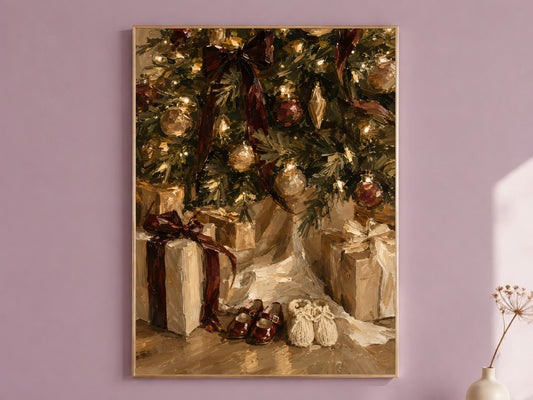 Christmas morning art print in a thin gold frame on a mauve wall, showing wrapped gifts and small shoes tucked under the tree, styled with a small vase of dried flowers