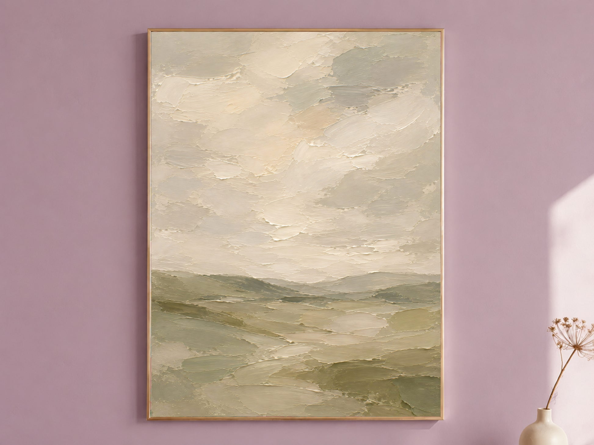 Framed sage green and cream textured cloudy sky landscape painting print hanging on a mauve wall