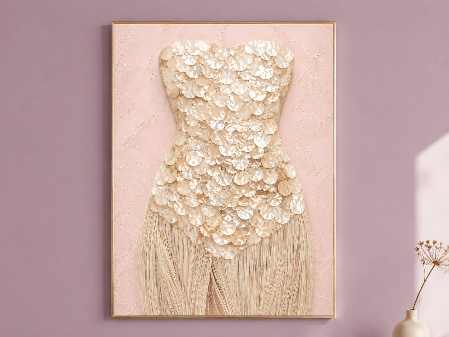 Champagne mother of pearl wall art print with sandy fringe, framed in gold against a mauve wall.