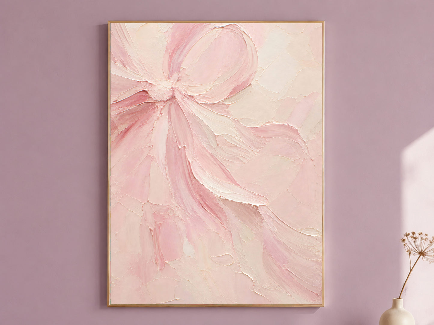 Framed blush pink textured impasto bow oil painting print hanging on a dusty mauve wall