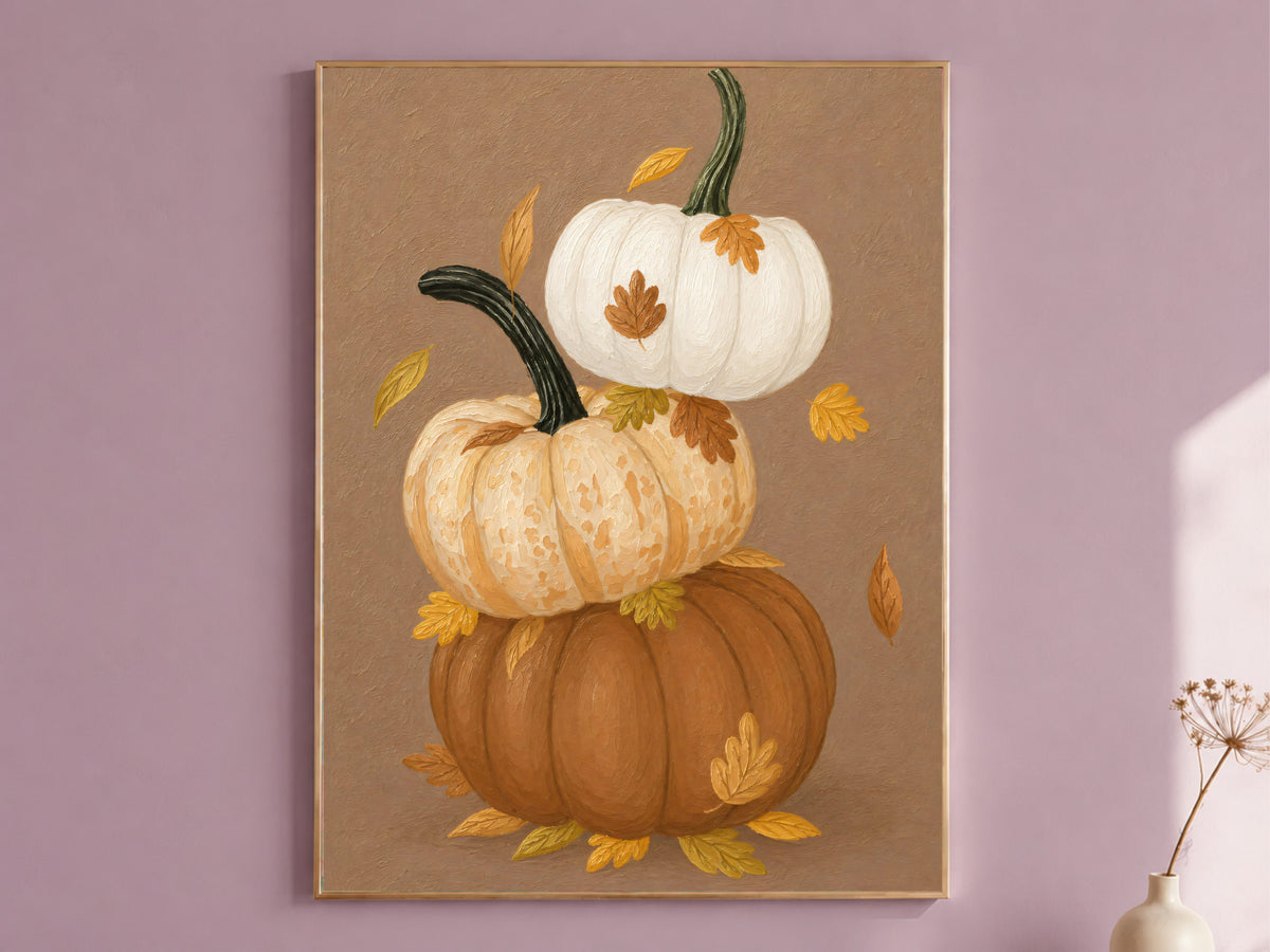 Stacked pumpkin wall art with autumn leaves in a mauve living room