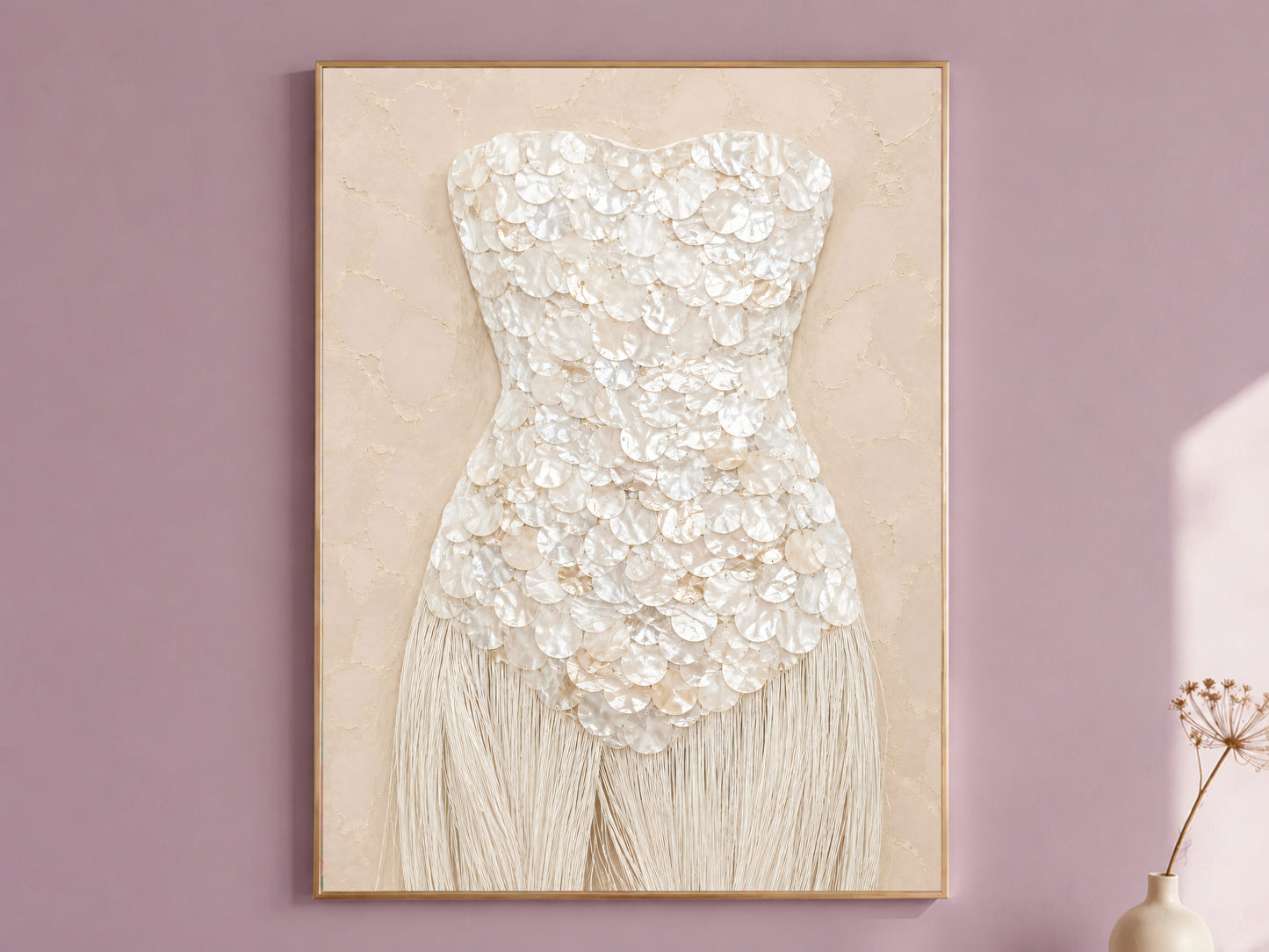Ivory mother of pearl wall art print, framed against a mauve wall.