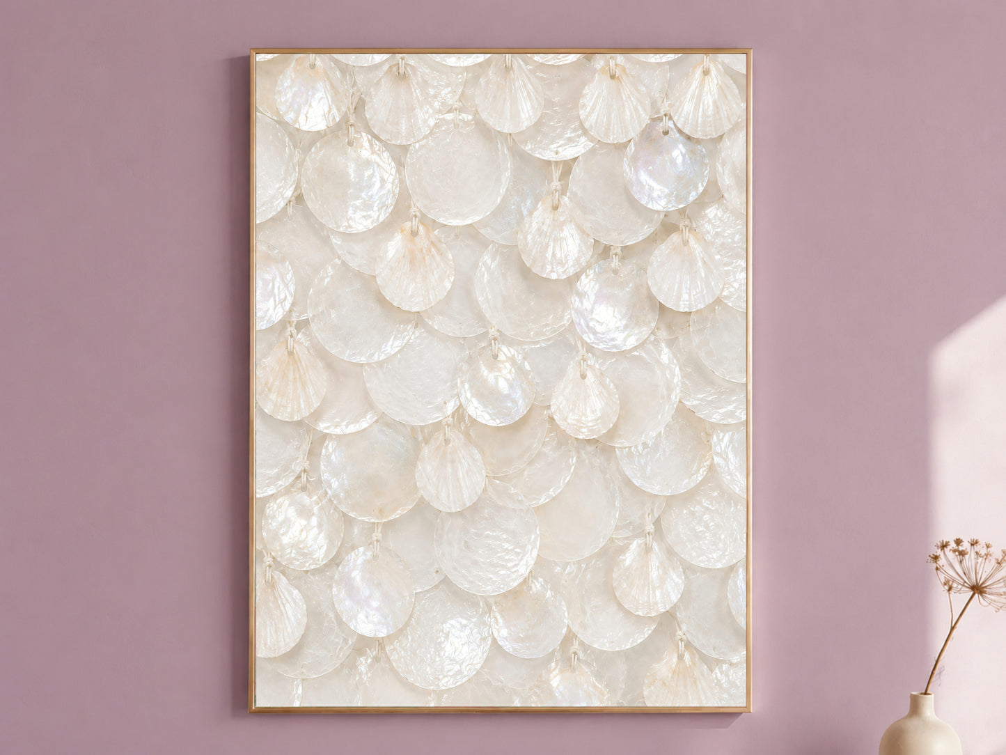 Framed white capiz shell wall art with ivory pearl texture, styled on a dusty mauve wall