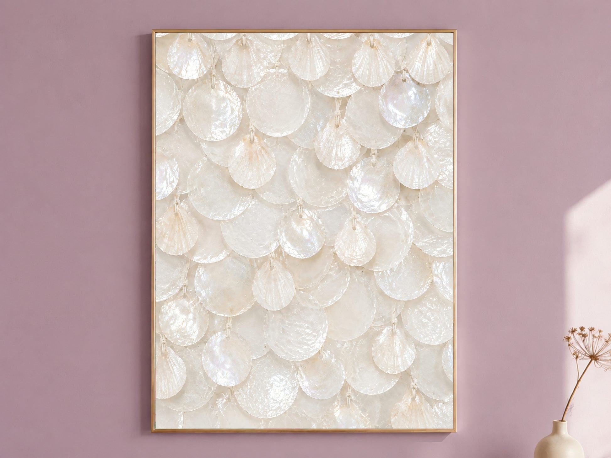 Framed white capiz shell wall art with ivory pearl texture, styled on a dusty mauve wall