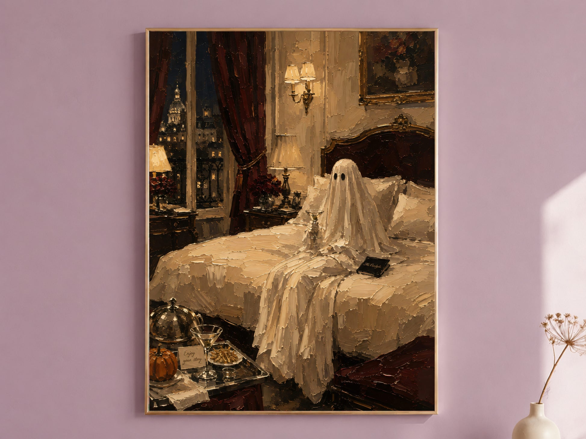 Bedroom with a luxury hotel Halloween art print in a dark wood frame above the headboard, ghost seated on the bed with a room service tray, styled with a small vase of dried flowers