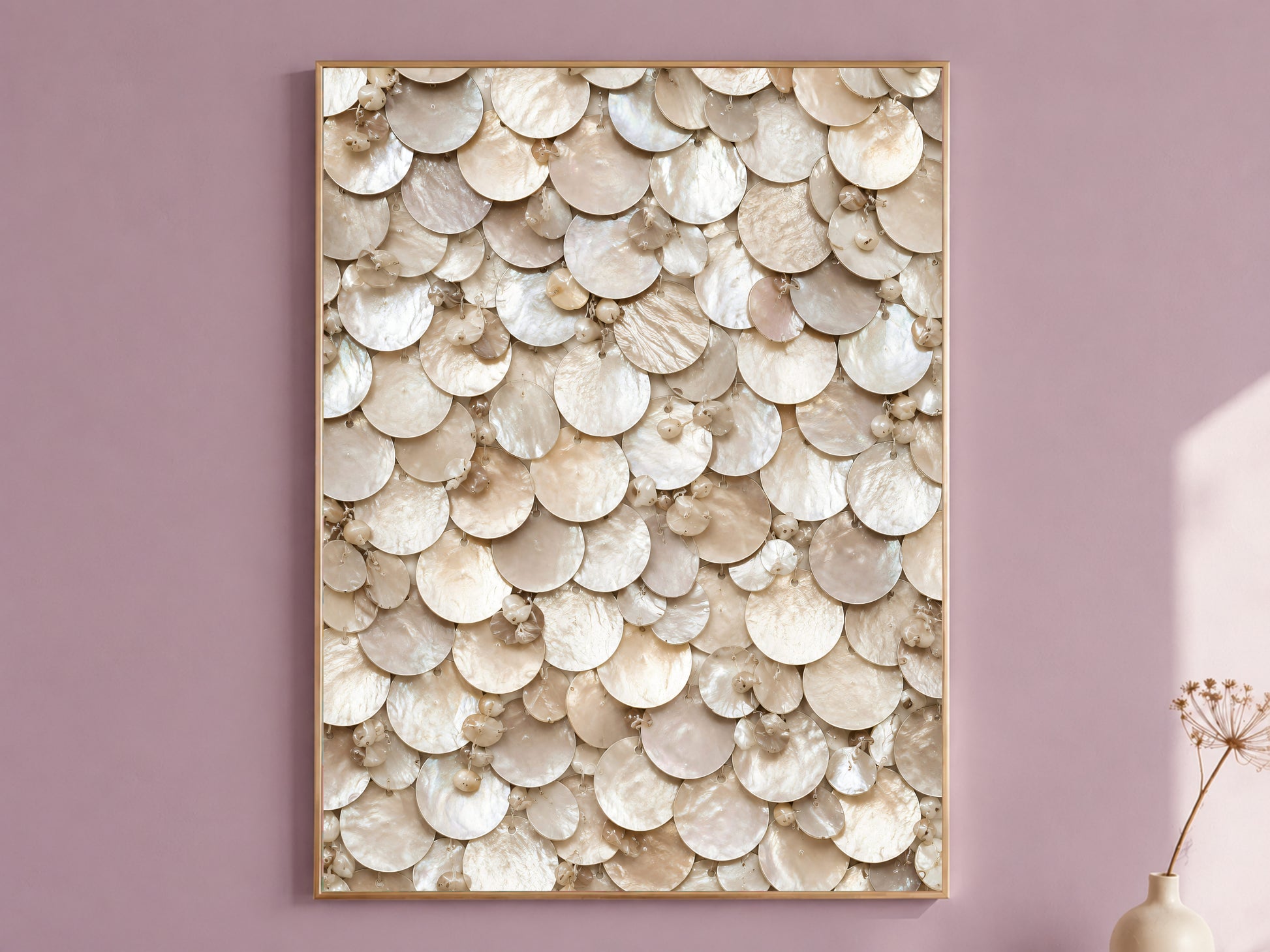 Framed champagne pearl wall art with beaded shell mosaic texture, styled on a dusty mauve wall