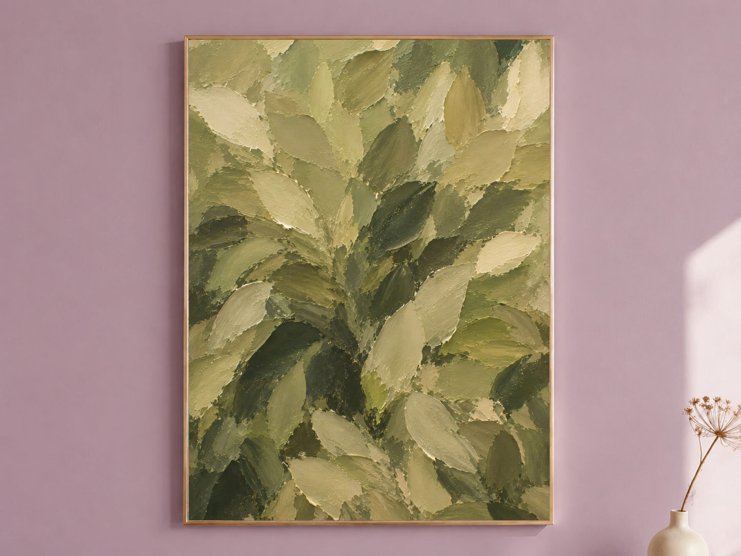 Framed olive green textured impasto leaf painting print hanging on a mauve wall