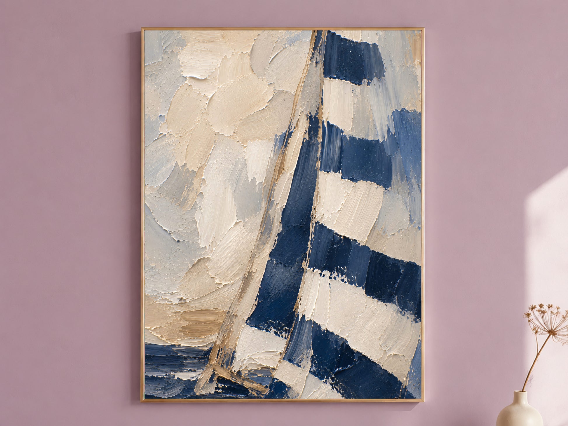 Framed navy and cream textured impasto sailboat painting print hanging on a mauve wall