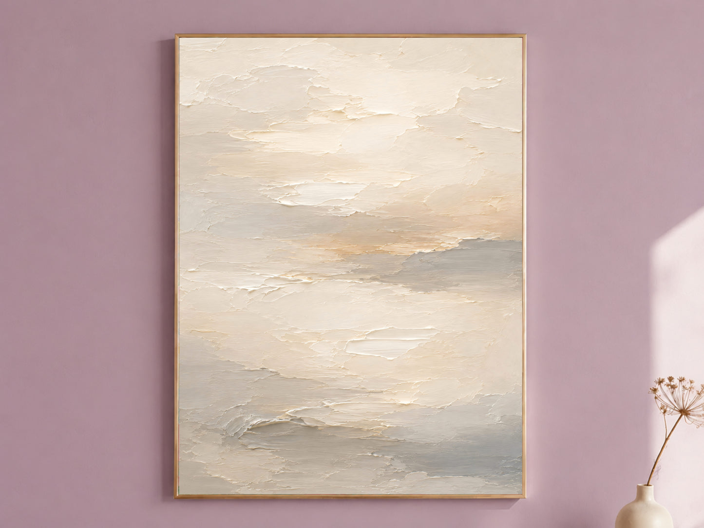 Framed neutral cream and warm white textured abstract cloud painting print hanging on a mauve wall