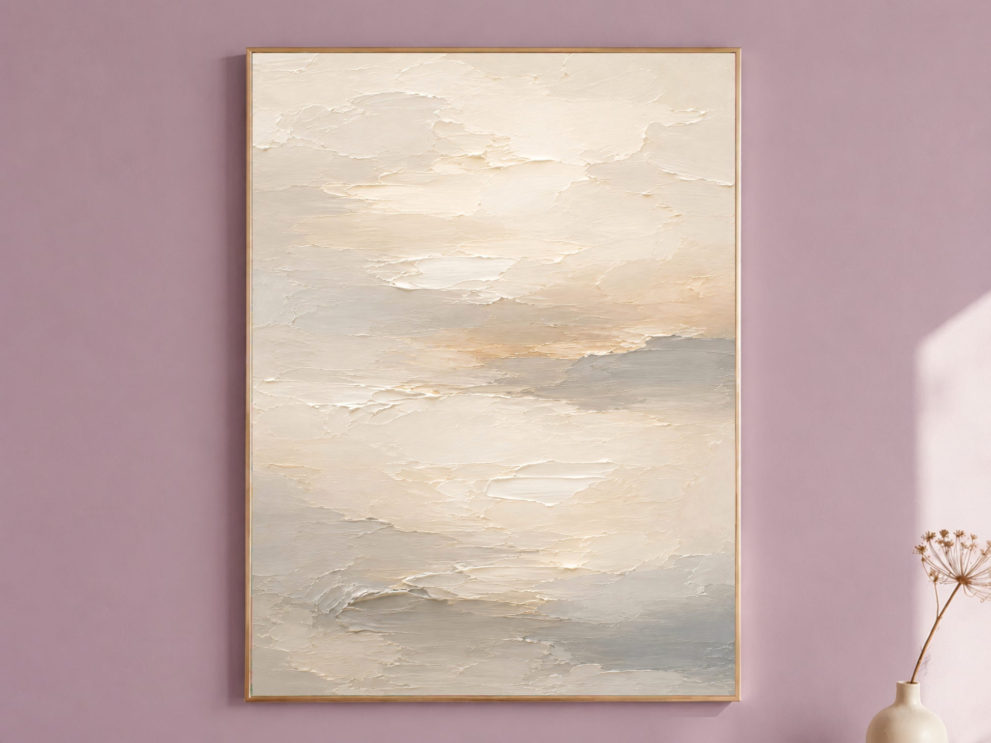 Framed neutral cream and warm white textured abstract cloud painting print hanging on a mauve wall