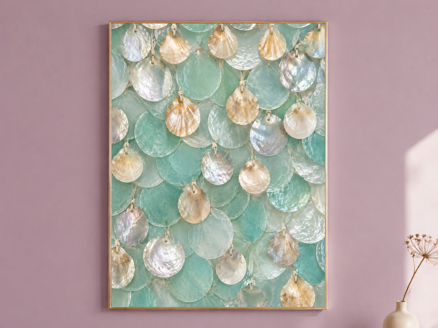 Framed seafoam capiz shell wall art with sea glass and honey shell texture, styled on a dusty mauve wall
