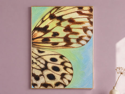 Framed teal and blue gradient butterfly wing wall art print on a mauve accent wall